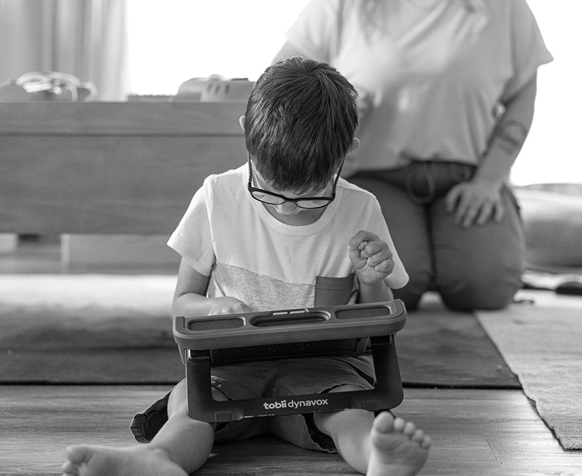 Autistic boy using a Tobii Dynavox  TD Navio speech generation device for ACC