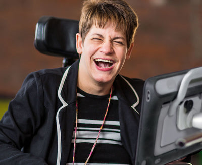 Woman using TD Speech Case to communicate